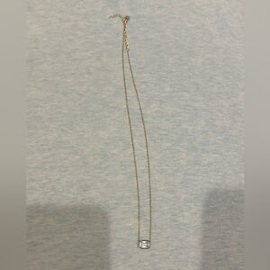 Gold light blue crystal necklace.